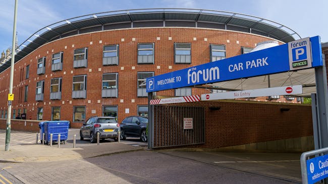 Entrance to The Forum's underground car park on Bethel Street Norwich with blue sign including a parking symbol.