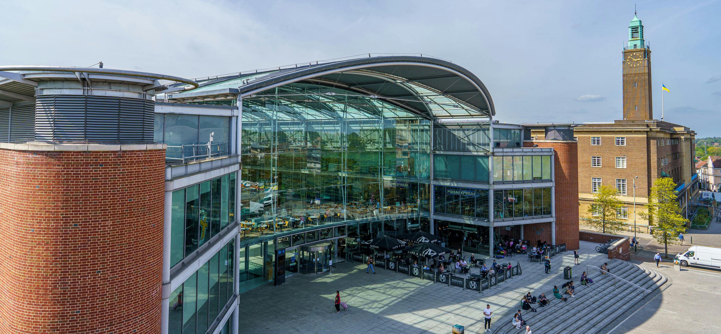 The Forum in Norwich, a modern landmark building with glass and curved roof.