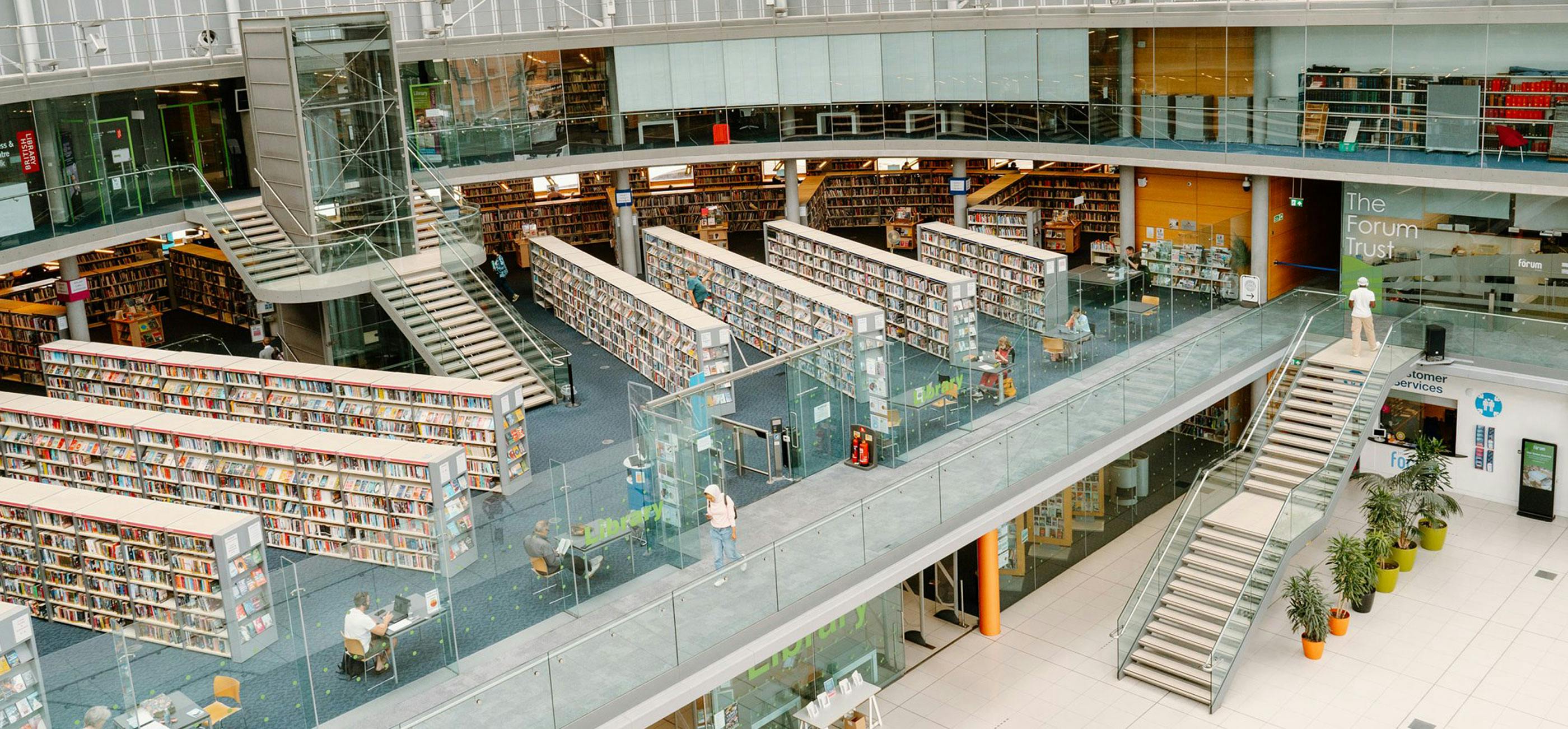 Millennium Library from above a modern, glass building full of light and books