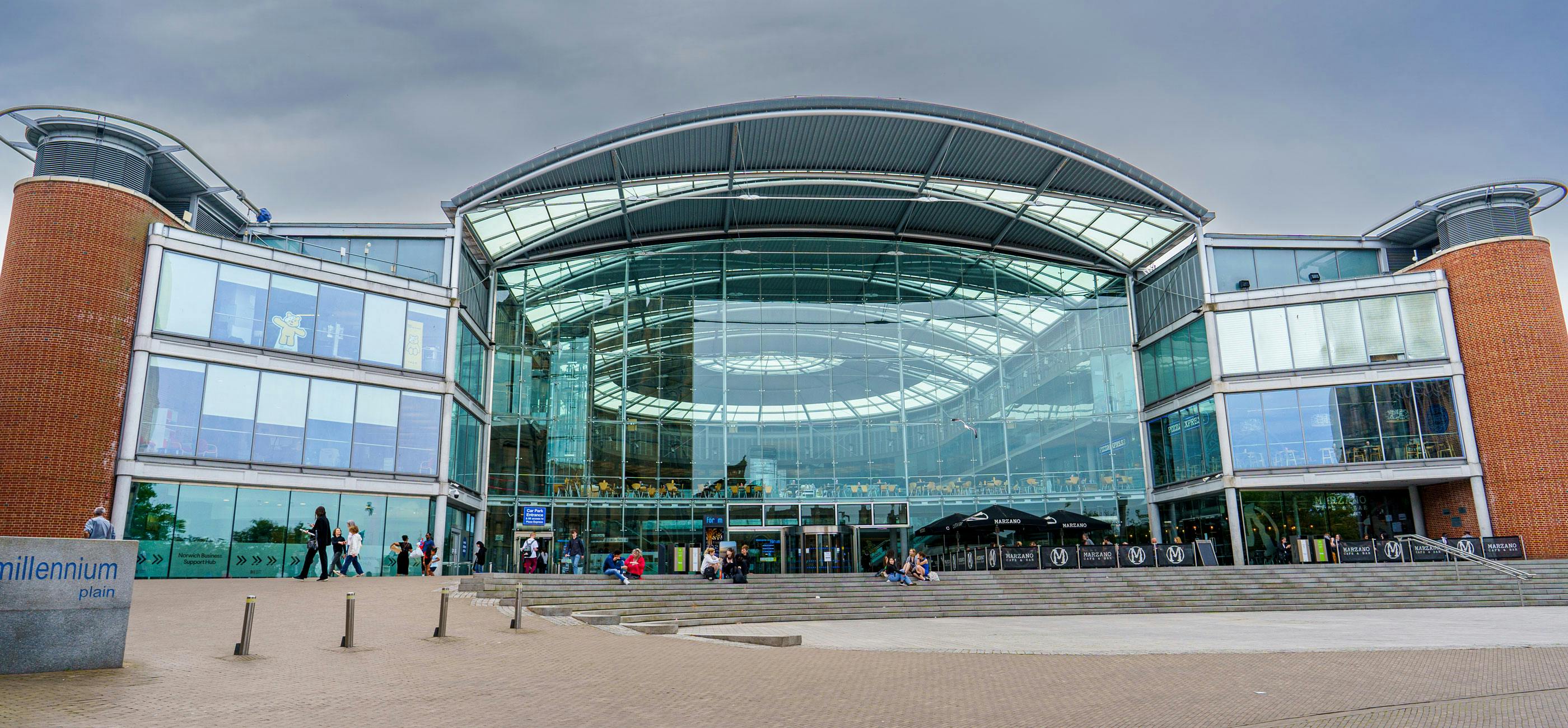 The Forum in Norwich, a large glass fronted building with a domed roof.