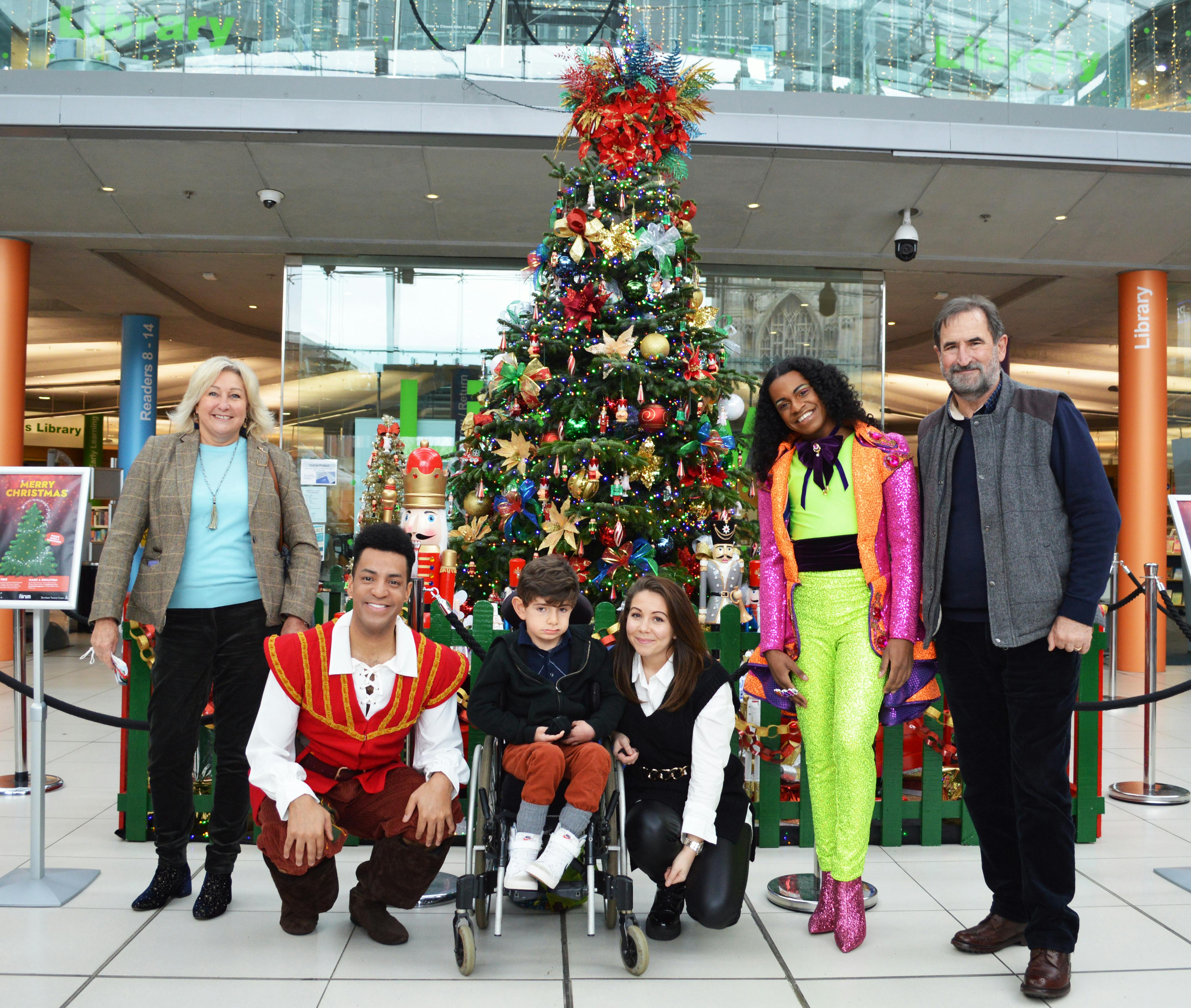 The Forum Christmas Tree with Elliott Frary (centre) with start from Dick Whittington and family members