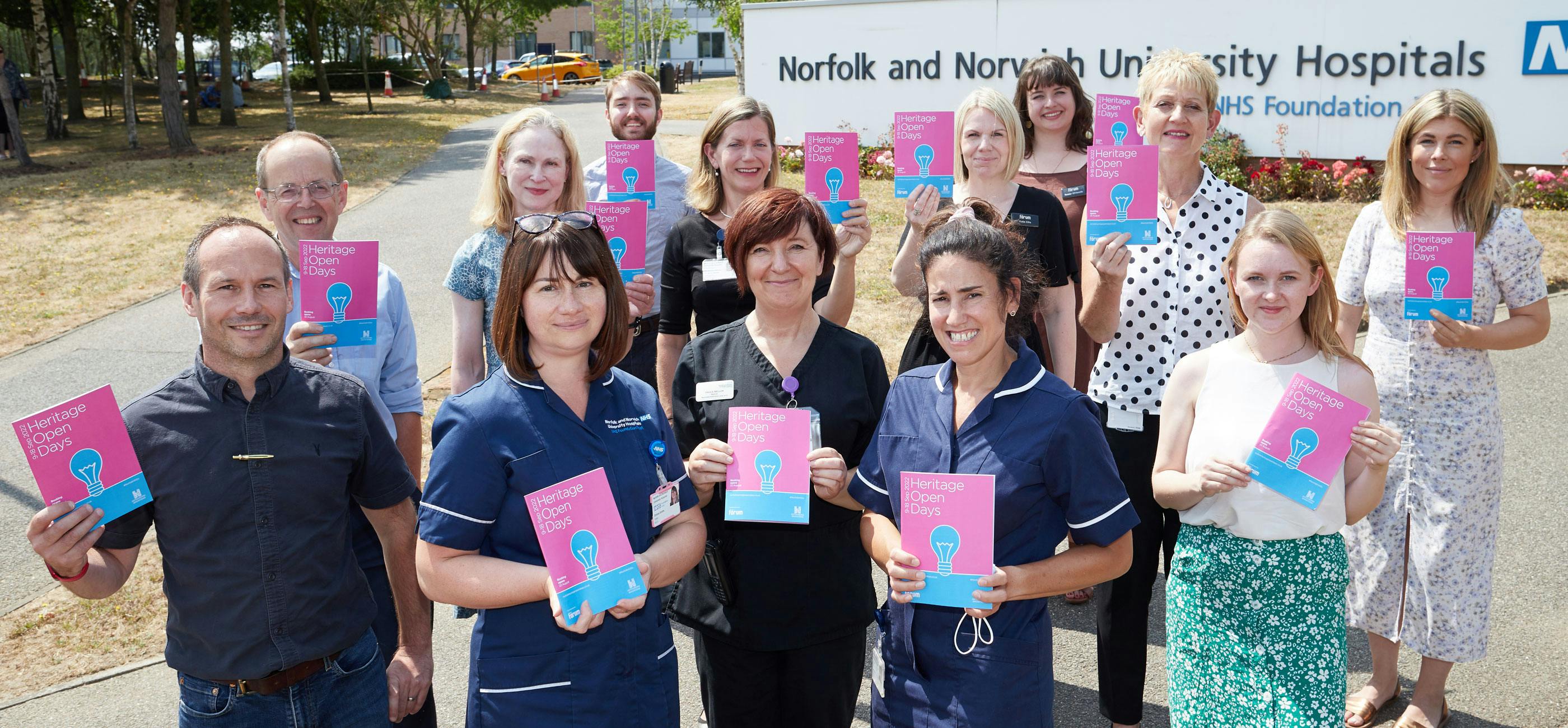 The Norfolk Heritage Open Day team, staff from the Norfolk & Norwich University Hospital hold up the 2022 Norfolk HODs brochure outside the hopsital.