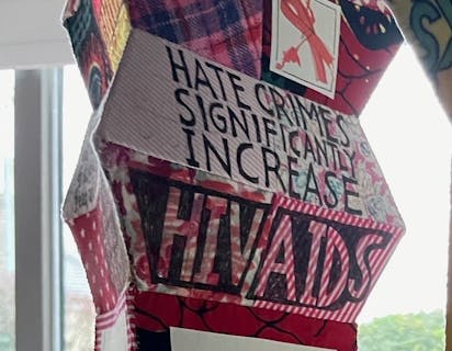 Lantern with 'Hate crimes significantly increase HIV/AIDS' written on it