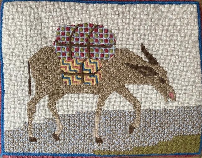 Embroidered kneeler with donkey design