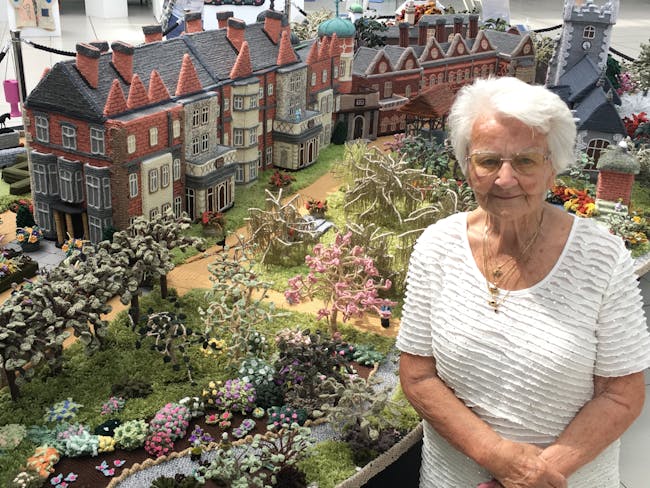 Woman standing in front of knitted Sandringham