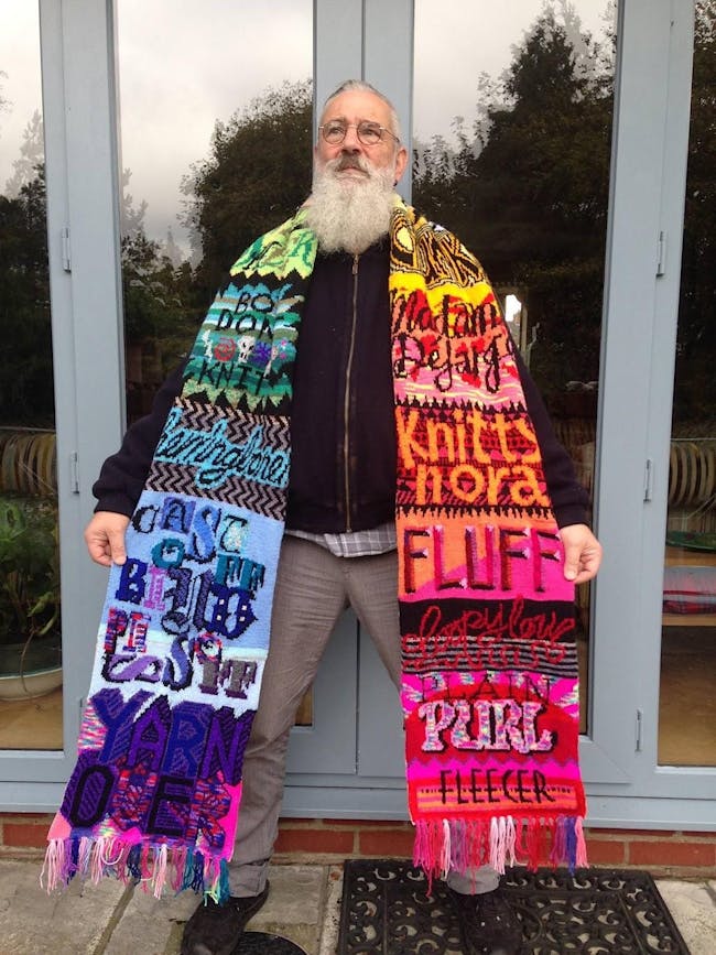 photo of bearded man wearing colourful scarf