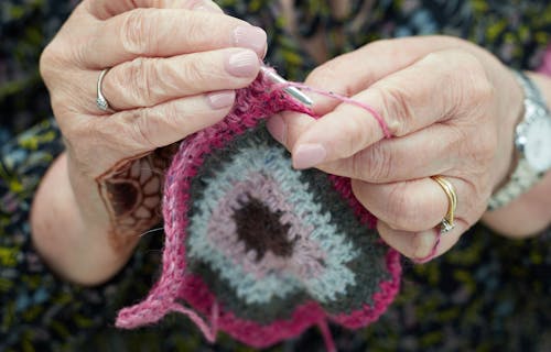 Hands crocheting.