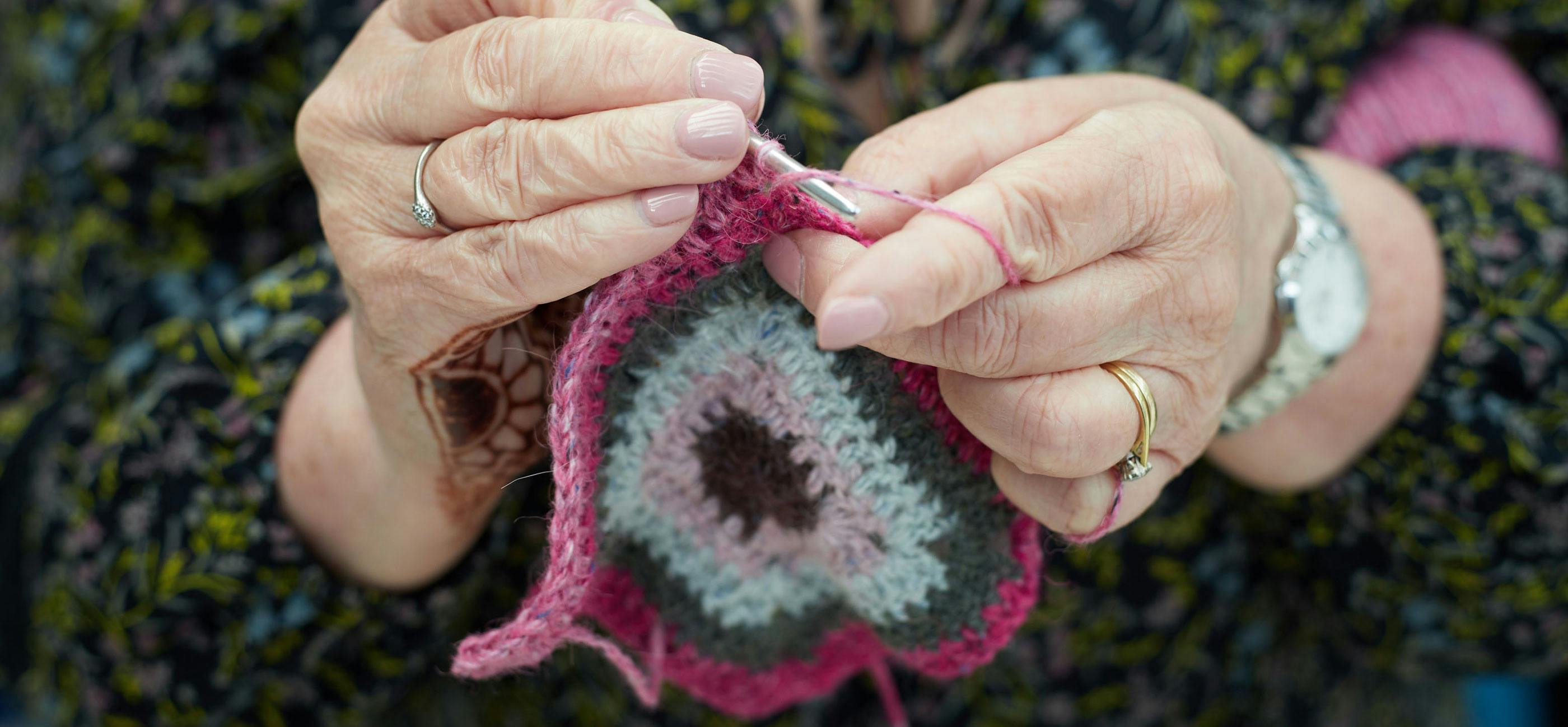 Hands crocheting.