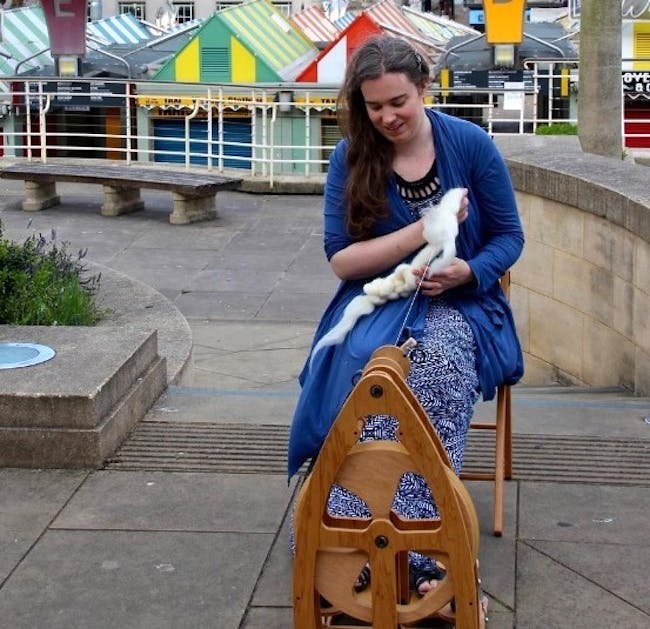 Woman using a spinning wheel