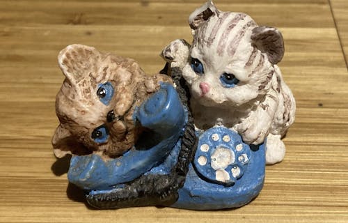 ceramic kittens on a phone painted