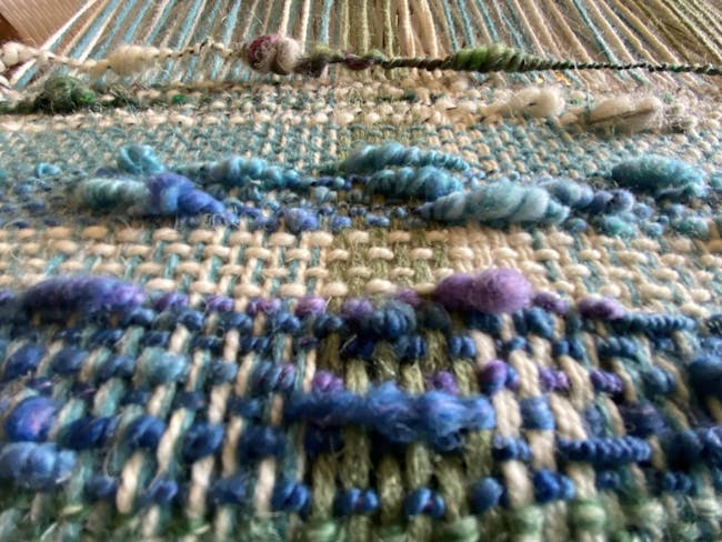 Close up photograph of colourful weaving
