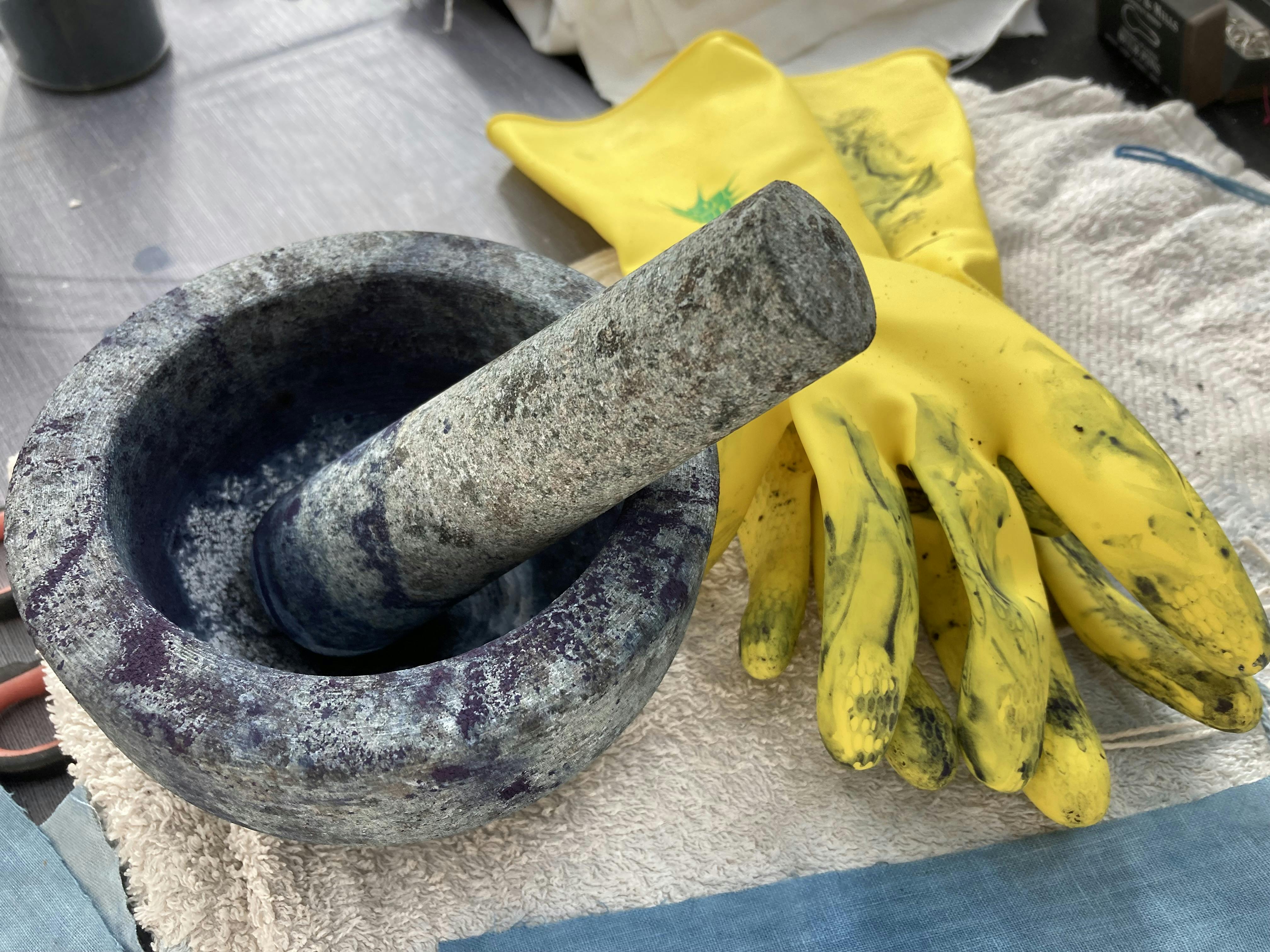 Pestle and mortar with rubber gloves