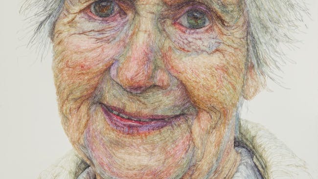 a detailed stitched portrait of a smiling older woman