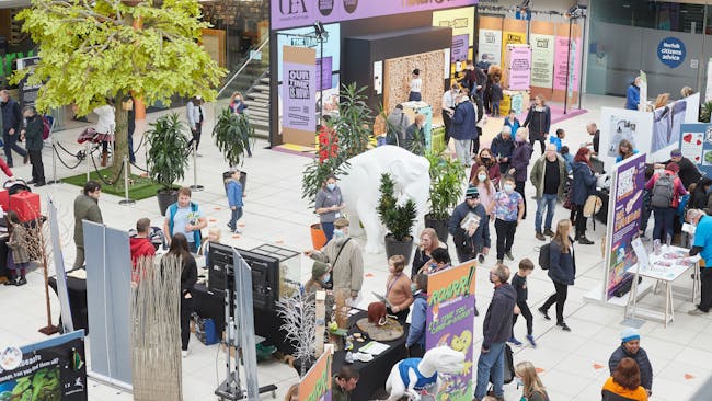 Crowds of visitors visit stands with fun activities at Norwich Science Festival 2021