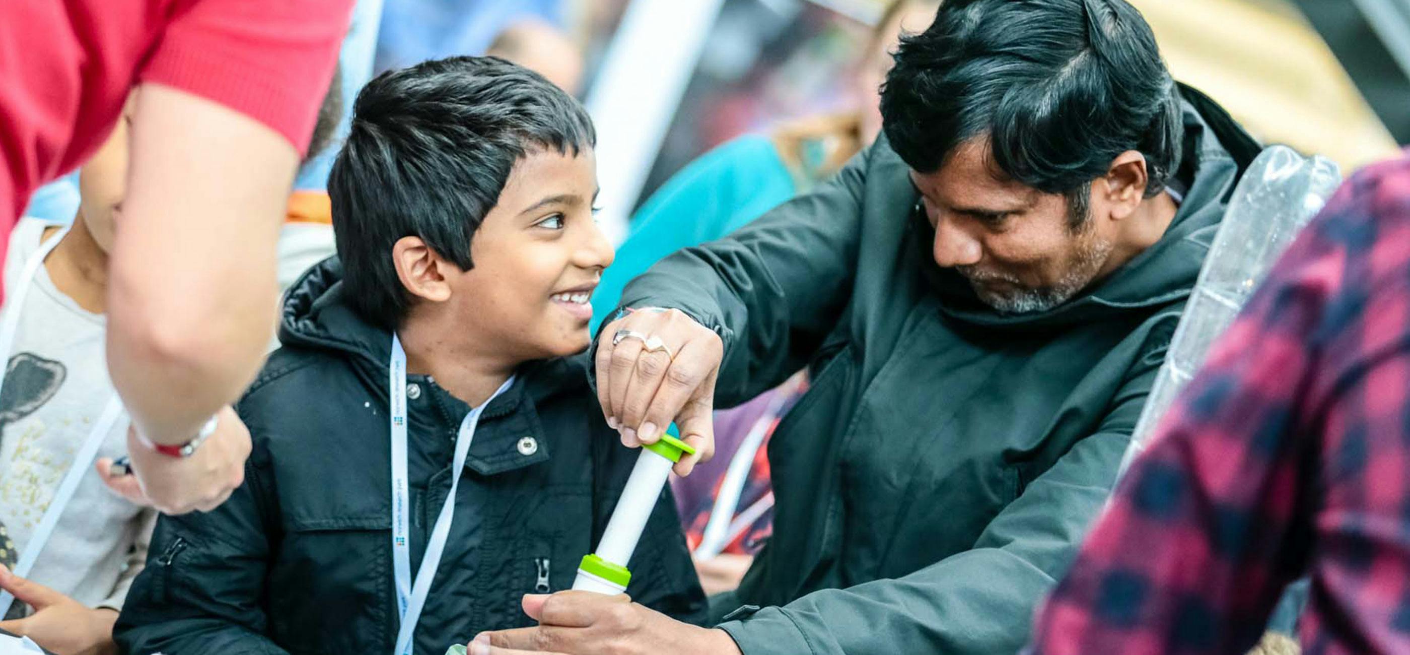 Boy and man at Norwich Science Festival 2019 - credit Mark Hewlett Photography