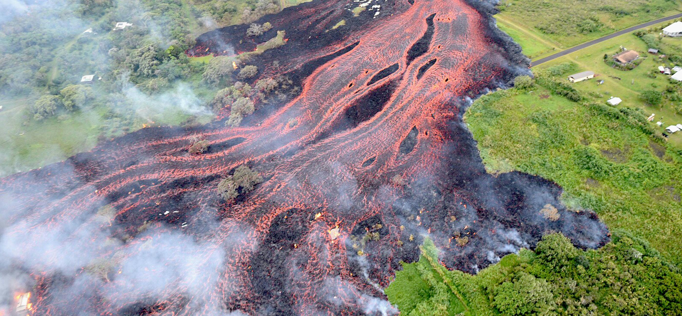 volcano magma spreading out over fields and homes