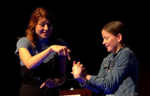 presenter and child on stage