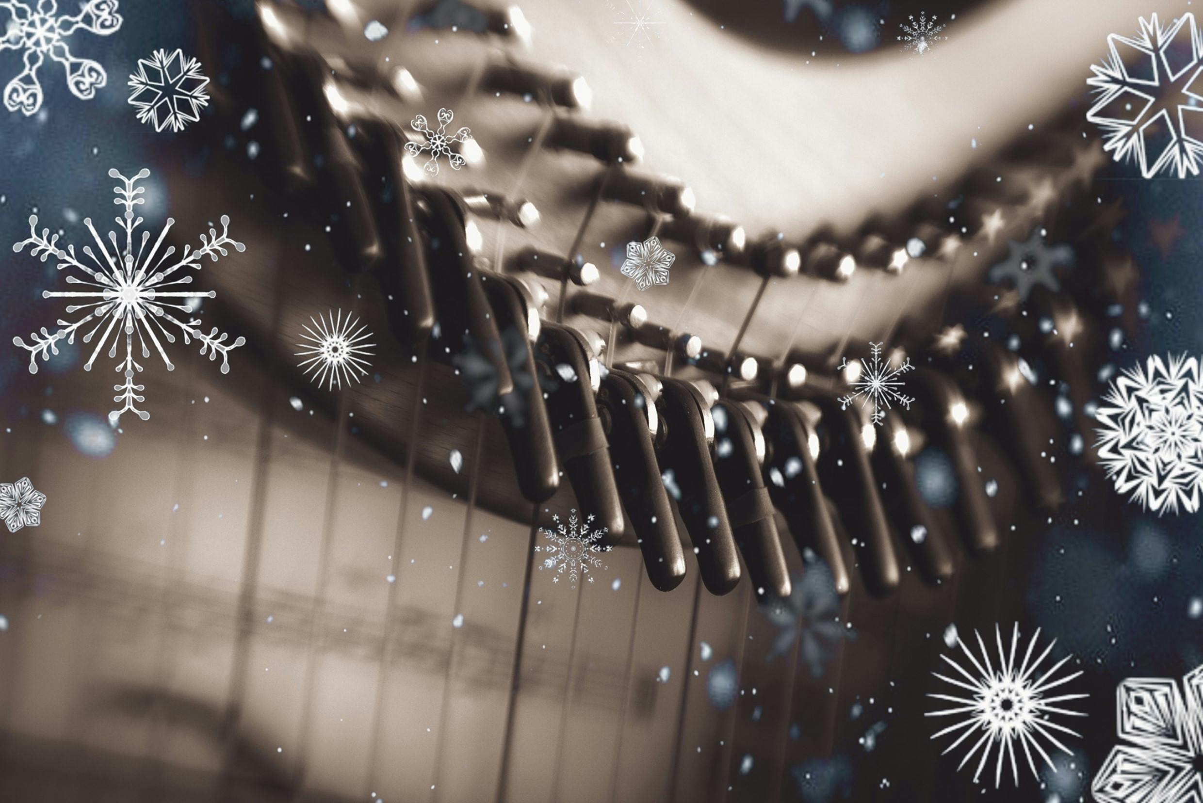 festive-harp.jpg Close up of a harp surrounded by snowflakes.