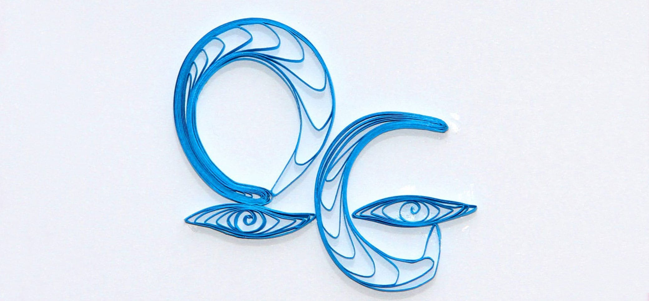 Blue quilling, rolled paper in a pattern