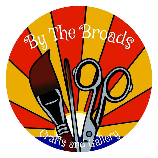 The By The Broads logo, showing a pair of scissors, a paint brush, and a stick against a red and yellow sunset.