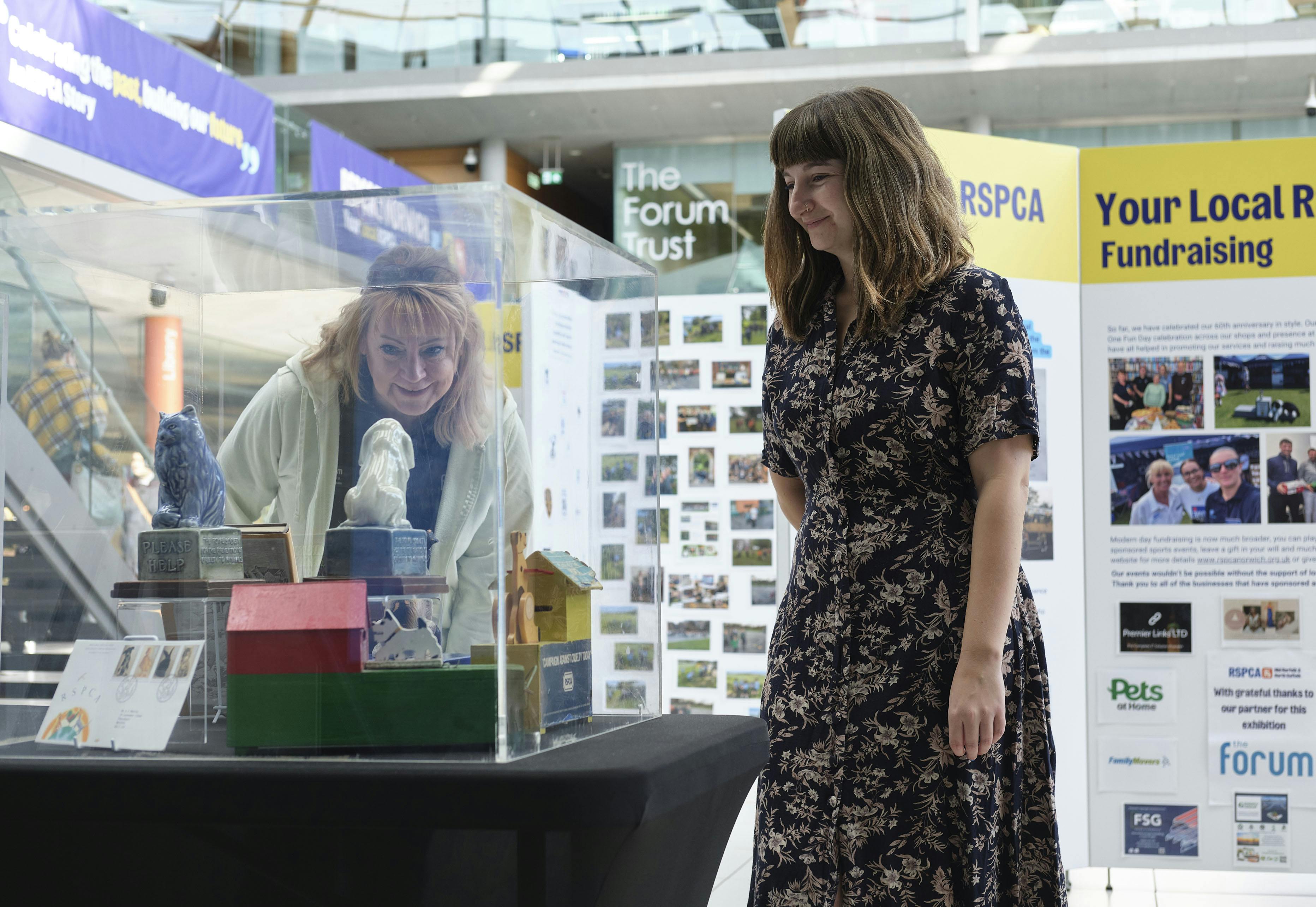 Two women looking at RSPCA exhibition