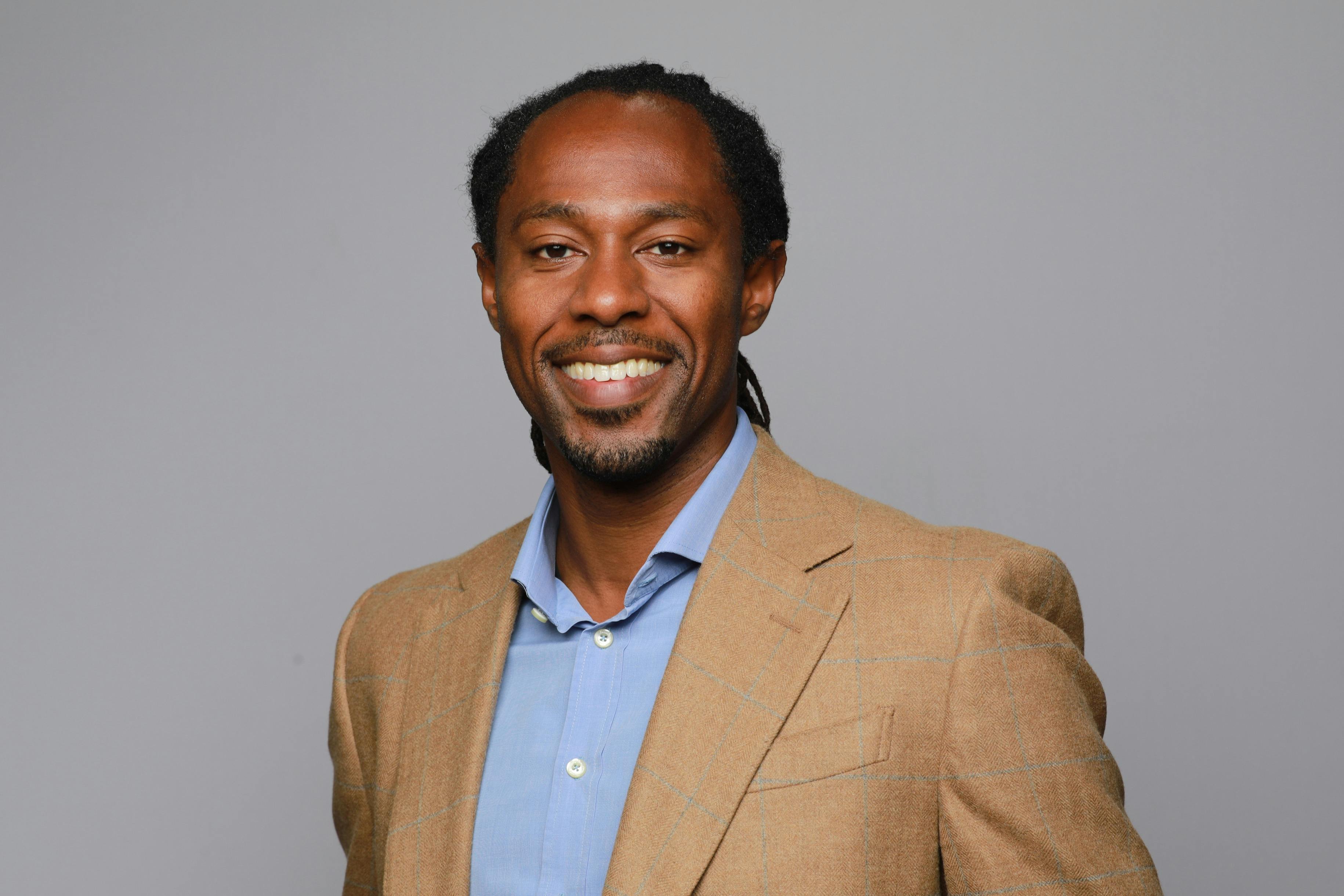 Author Professor Keon West smiling.