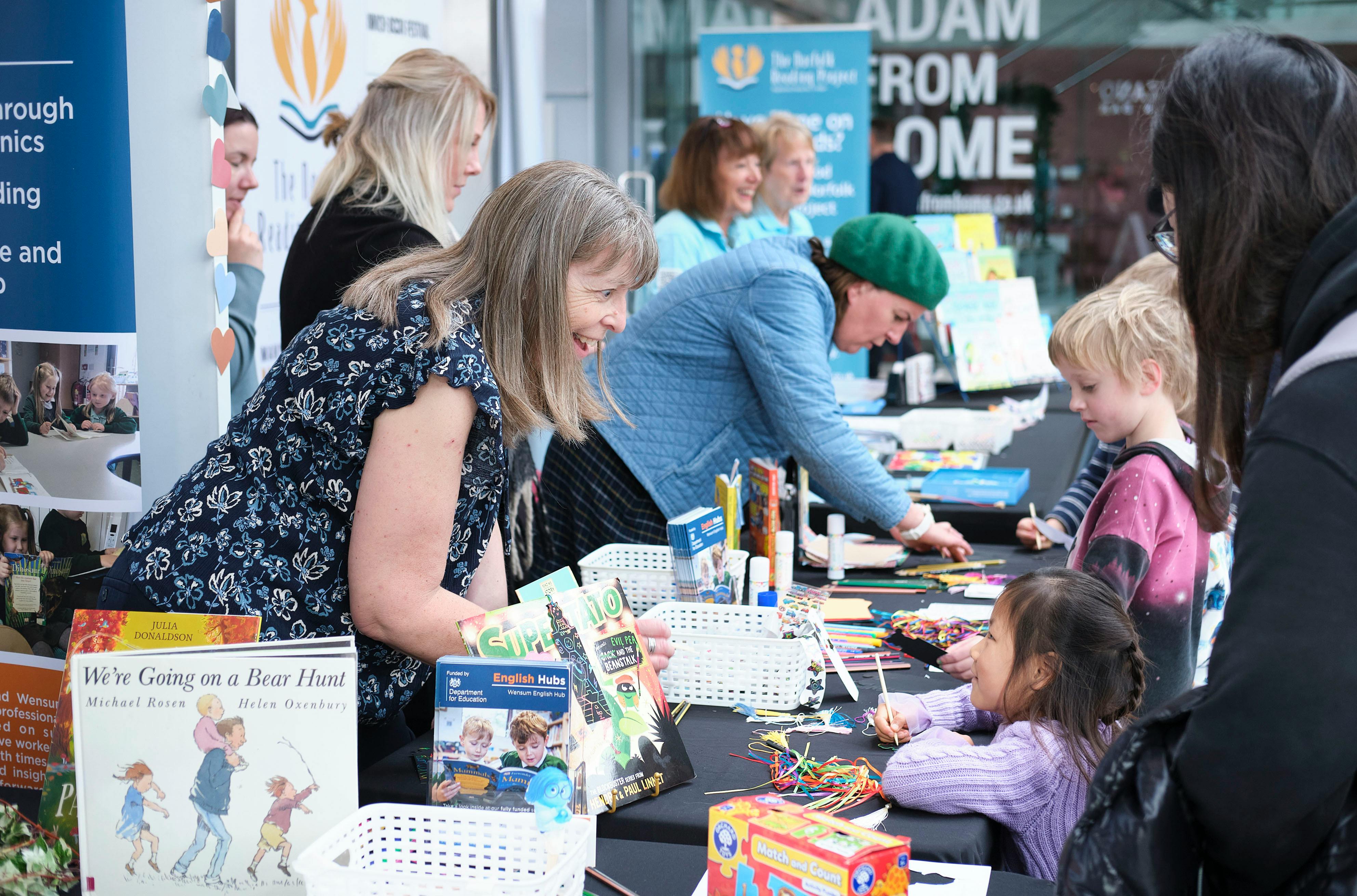 Children engaging with stallholders