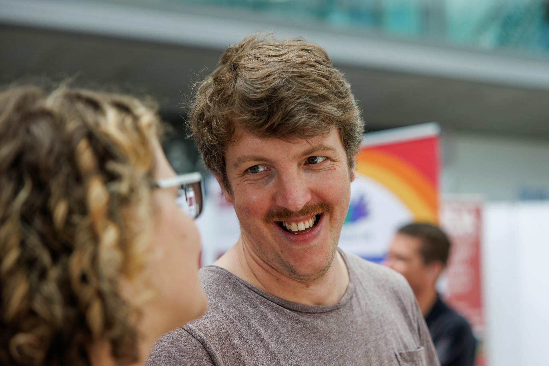 A smiling man with a moustache.