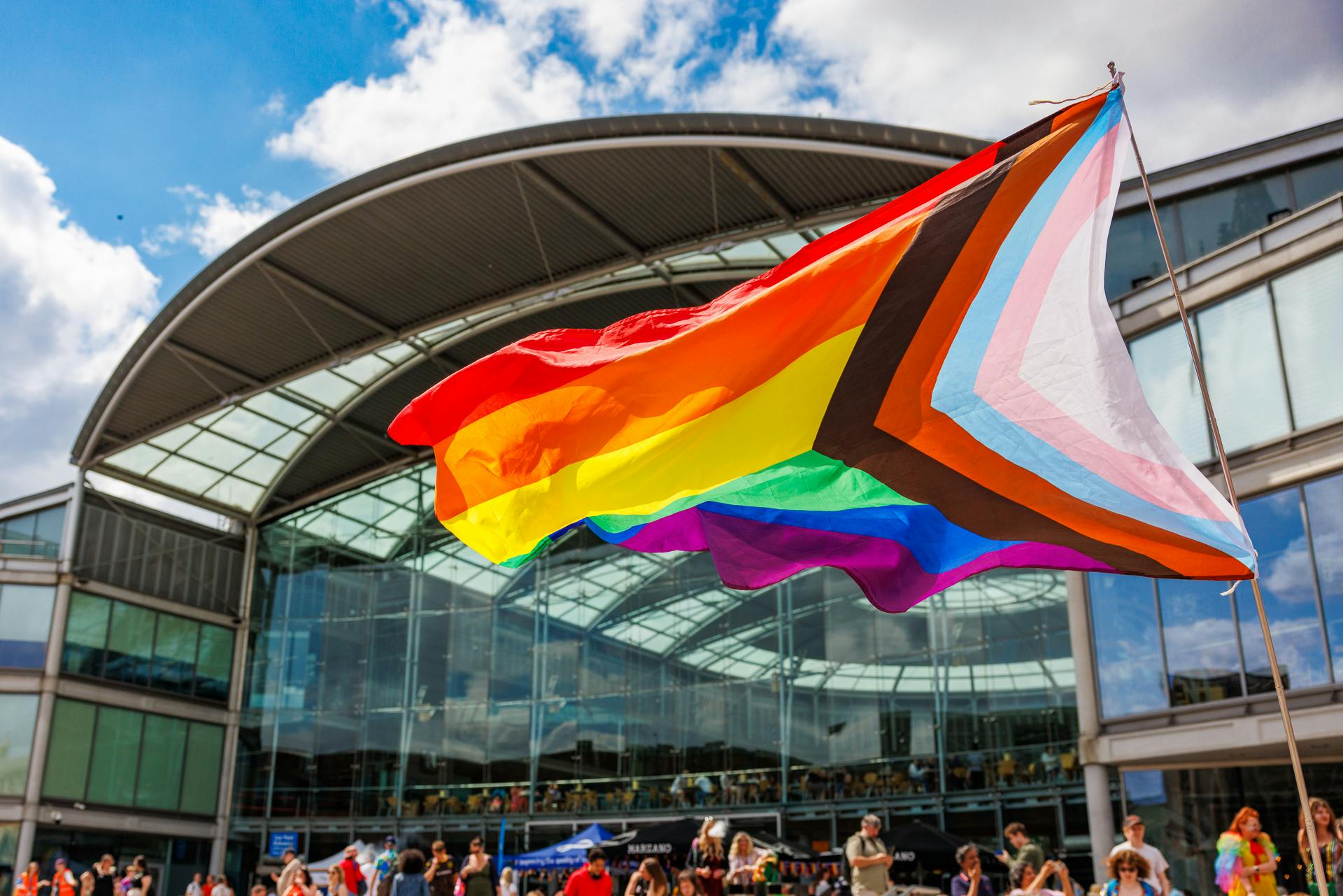 A pride flag waving outside The Forum Norwich