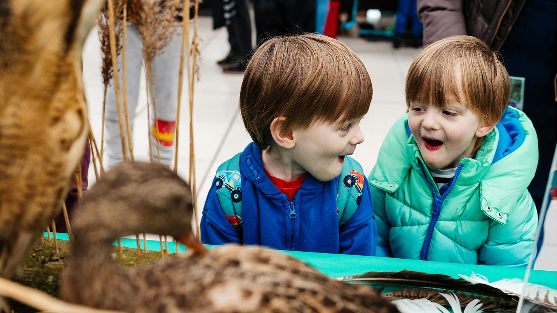 Two children look wowed in The Explorium at The Forum