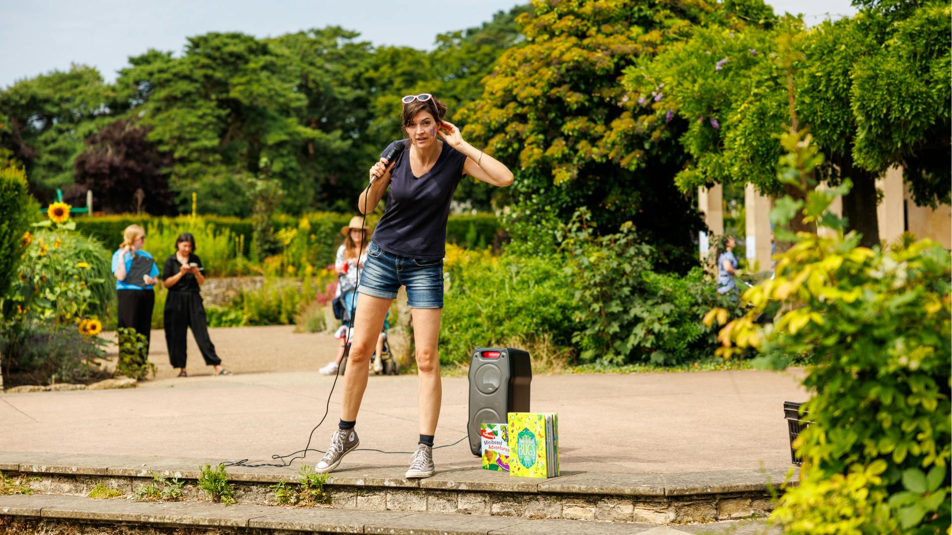 Jess French performing to a crowd at Bugs and Beasts 2024