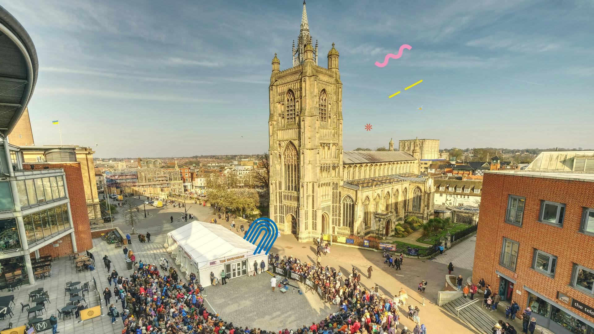 A large crowd gather outside The Forum for a performance during Norwich Science Festival