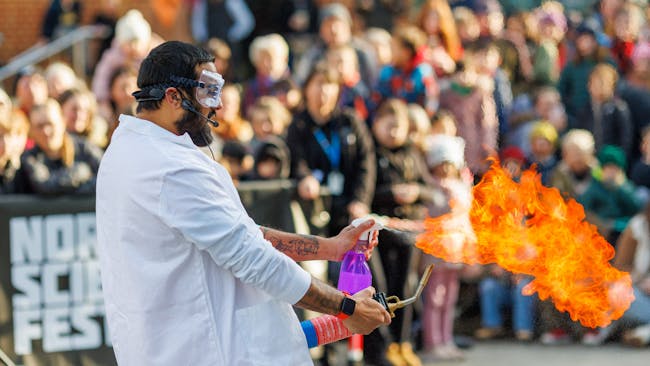Dr Nikhil Mistry setting the expulsion from a spray bottle on fire.
