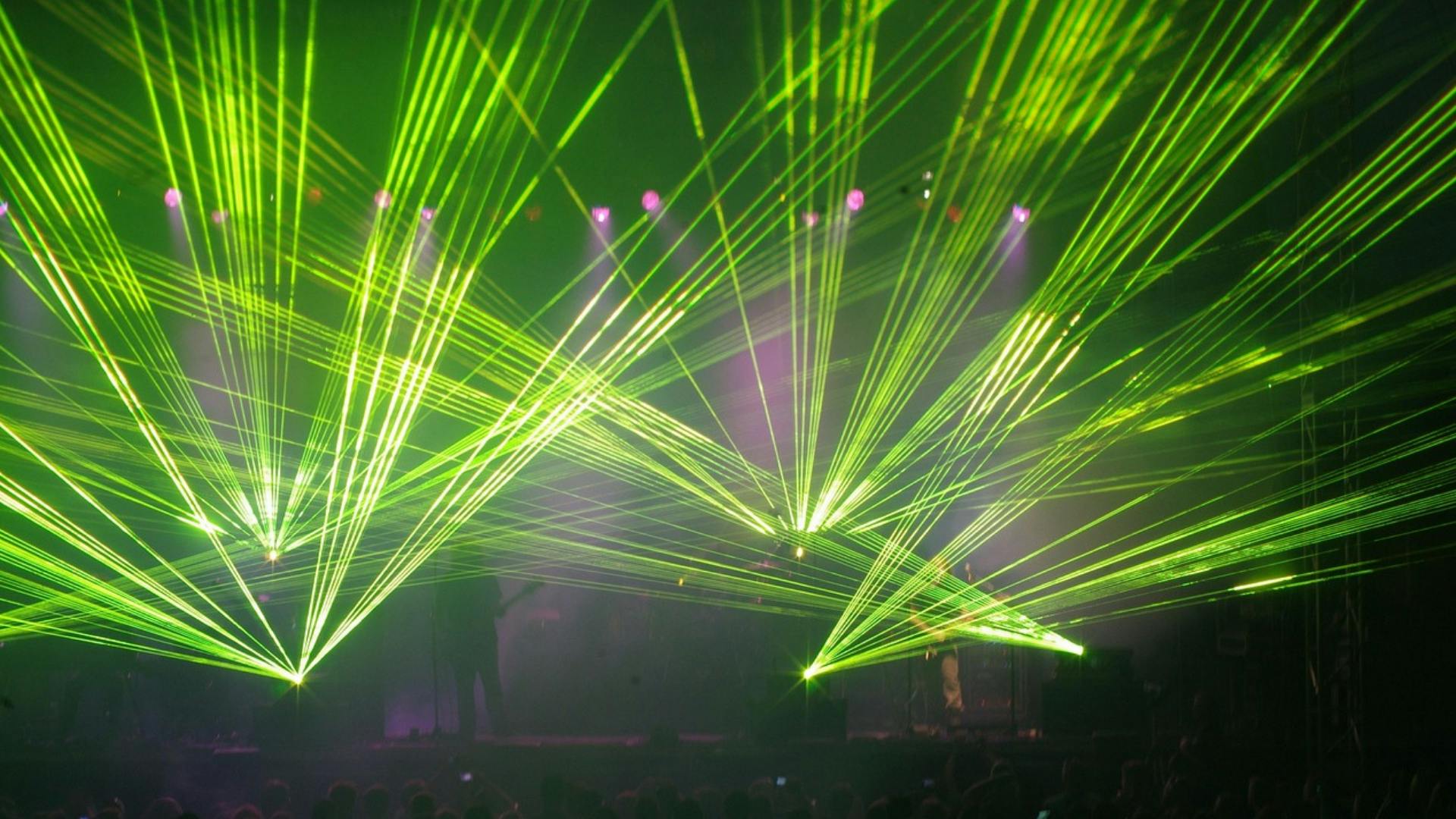 web-lasers-the-light-fantastic.png Green lasers during a music show.