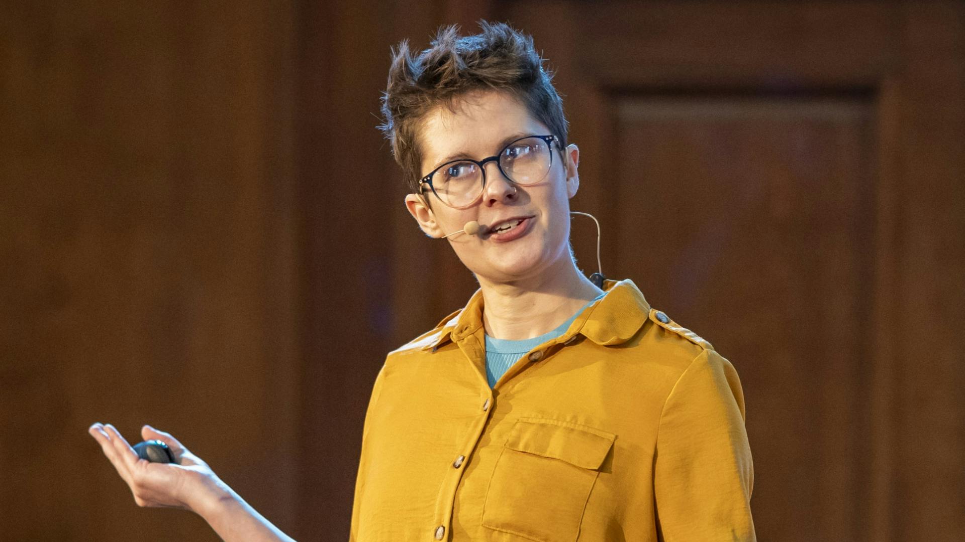 web-that-s-nosense.png Speaker Nate Rae talking on stage.