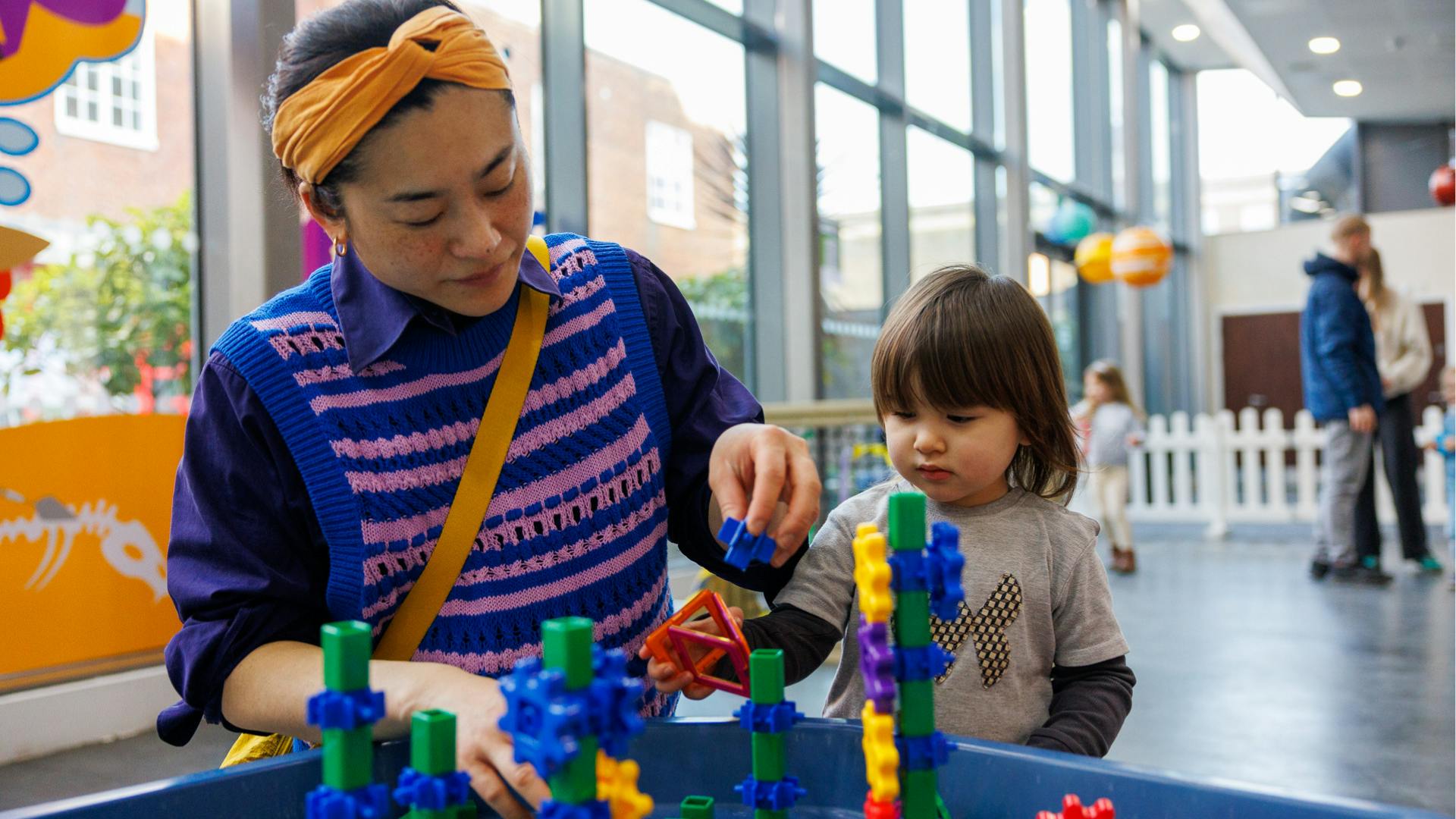 A parent and child play together during a WonderTots session at Norwich Science Festival