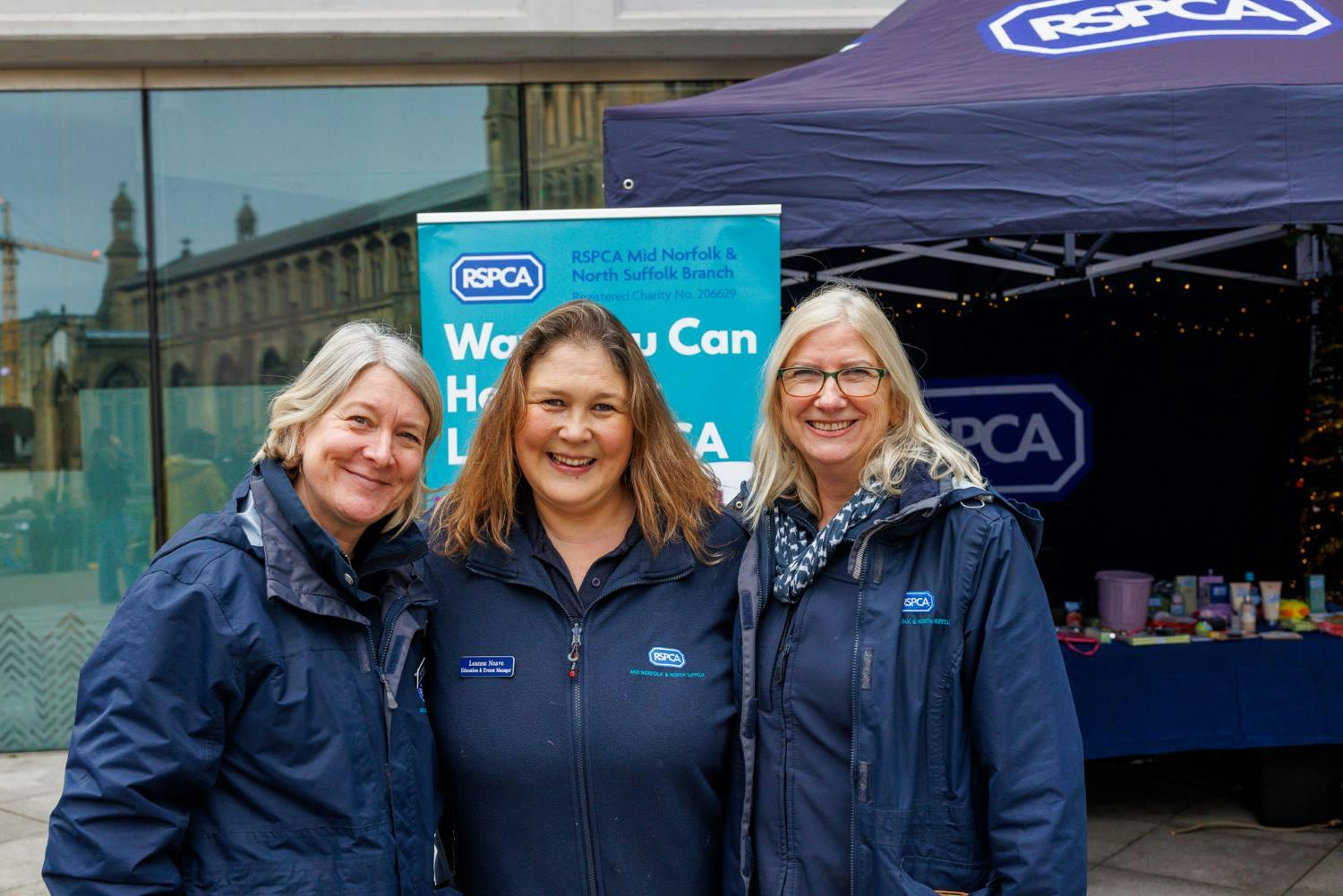 Image of three RSPCA staff smiling outside The Forum