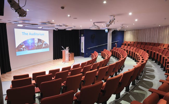 An empty auditorium with the lights switched on.