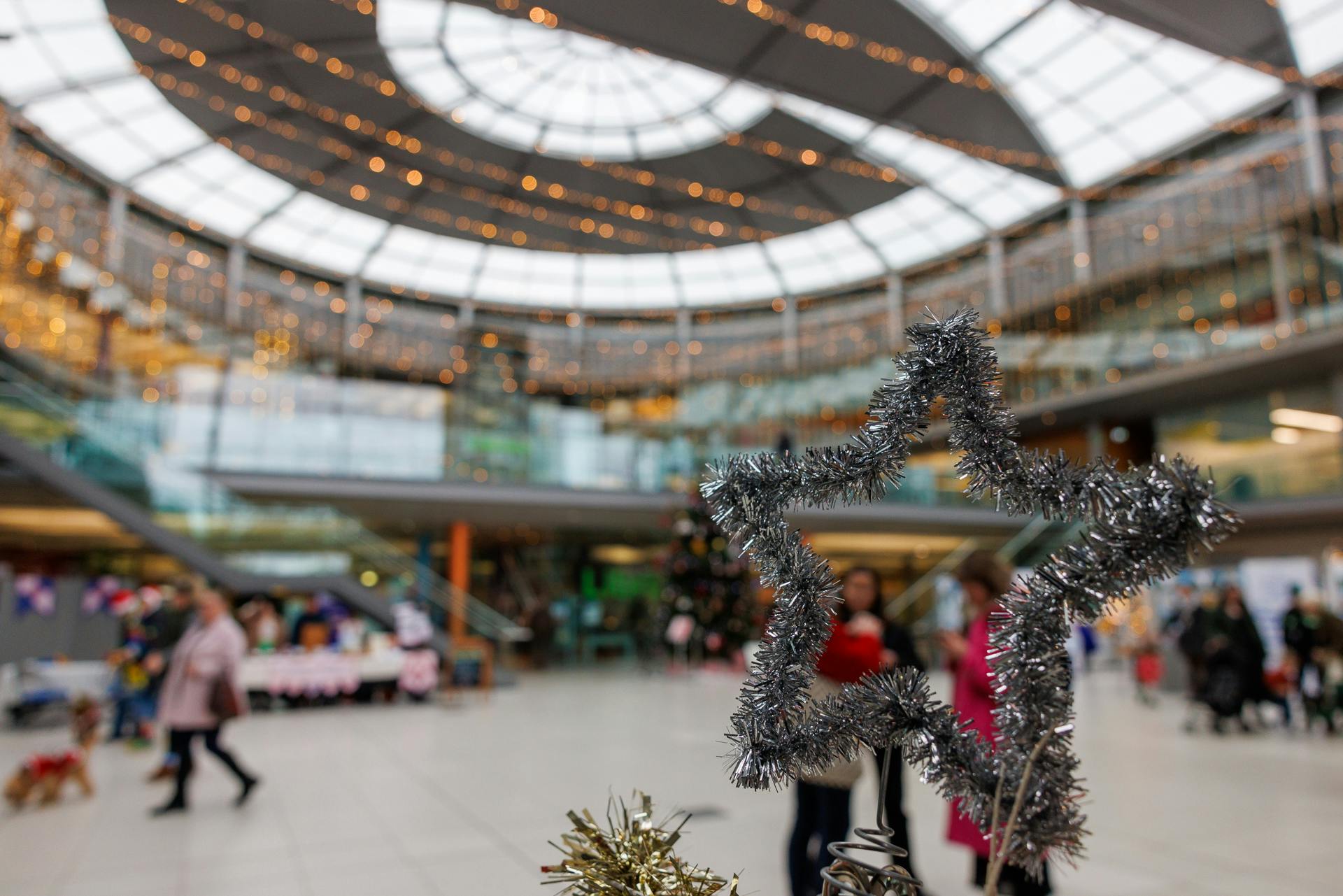 A tinsel star in focus in The Forum's Atrium, blurred